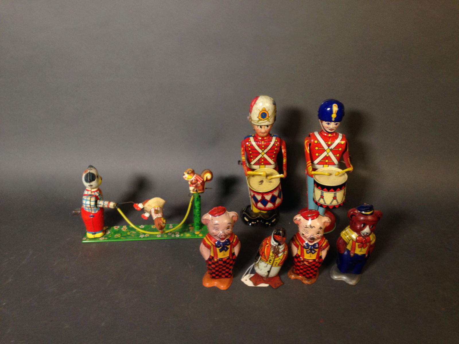 7 Vintage Tin Litho Wind Up Toys, MARX & J. Chein: 7 Vintage Tin Litho Wind Up Toys, Marx & J. Chein & Co. ++ Louis MARX & Co. drummer toy, 9.25" tall ++ J. Chien drummer boy, 9" tall ++ Four J. Chien walking animals, two pigs, penguin, & bear, talles