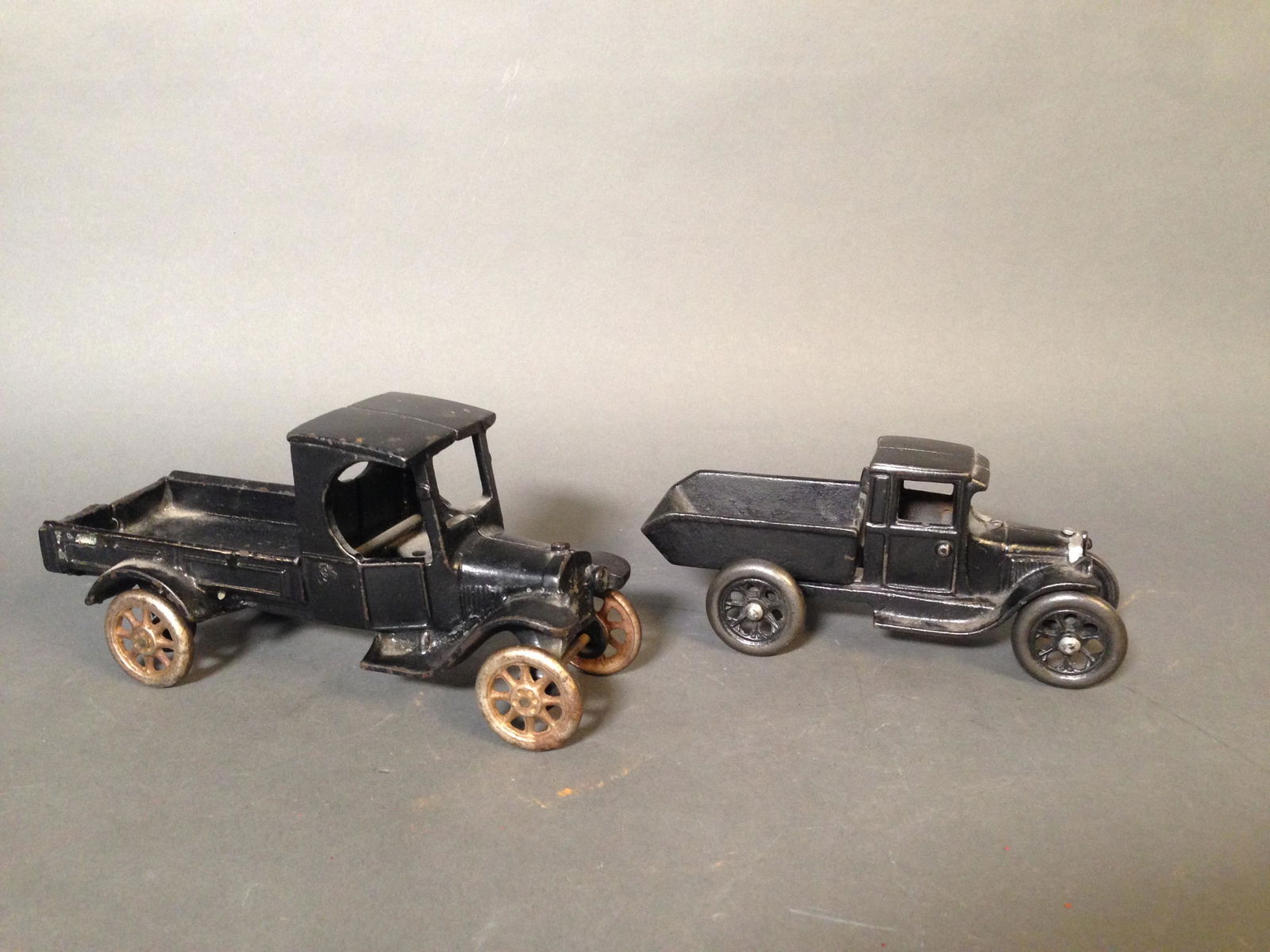 Two Arcade Cast Iron Ford Pickup Trucks: Two Arcade Cast Iron Ford Pickup Trucks ++ Large truck marked "Made by Arcade MFG. Co., 8.5" x 4" x 3.5" ++ Pickup truck with tilting dump bed 219 marked "Arcade," 7" x 3.25" x 3"_x000D_ Condition: We