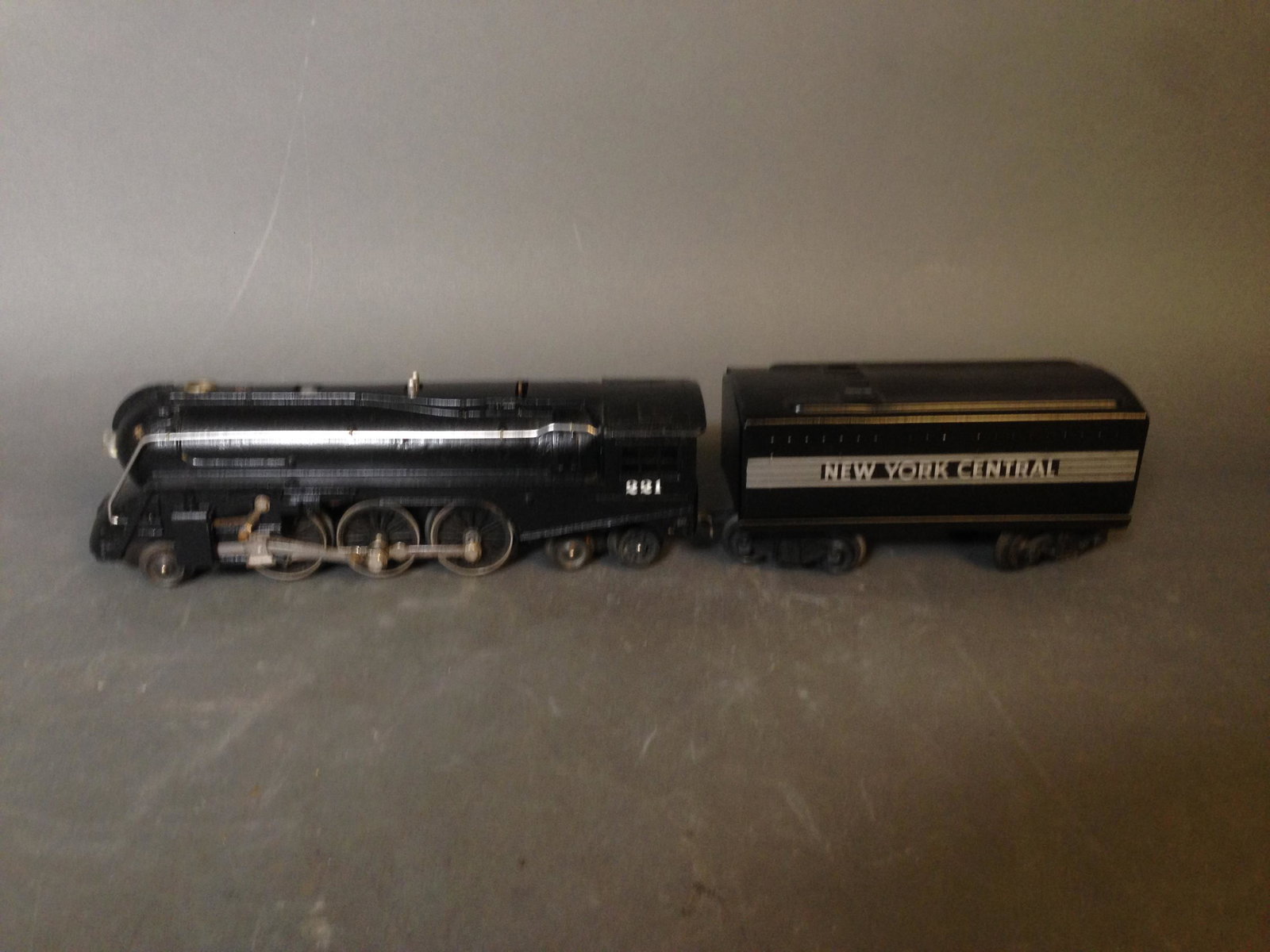 1947 Lionel 221 Dreyfuss Hudson Engine: 1947 Lionel 027 Gauge 221 Dreyfuss Hudson Engine & 221W Tender_x000D_ Condition: As is, untested. Wheels move with resistance. Engine and tender show very little paint loss or wear. Loss of paint near