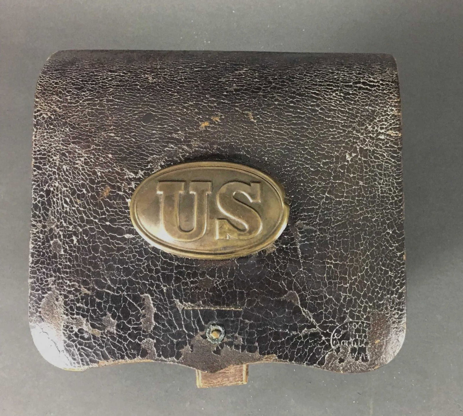 M1864 Union Army Cartridge Box.: [Gear/Supplies] Leather, with embossed â€œUS” on front flap, and brass â€œUS” plate bolted to flap over the embossed letters, to create uniformity with earlier boxes. Inspectors an