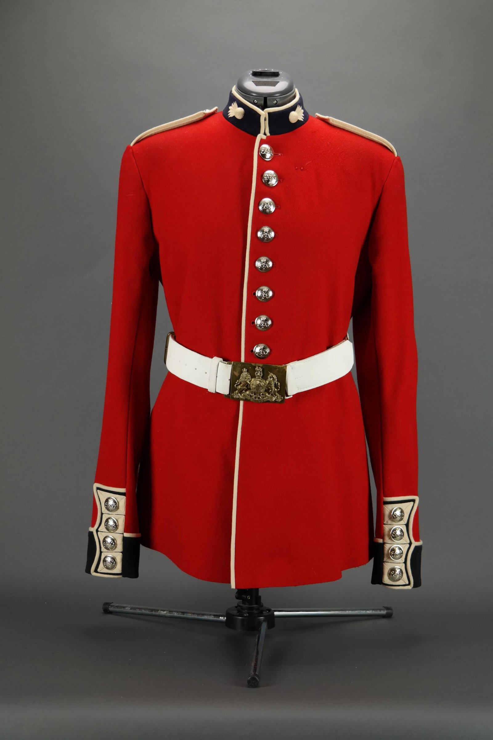 Grenadier Guards Regimental Tunic And Belt.: [Uniforms] Grenadier Guards Regimental Tunic. With grenade insignia on collars, motto on epaulets, and buttons featuring royal cypher. Label on interior. Made by Kashket & Partners, Ltd. With painted 