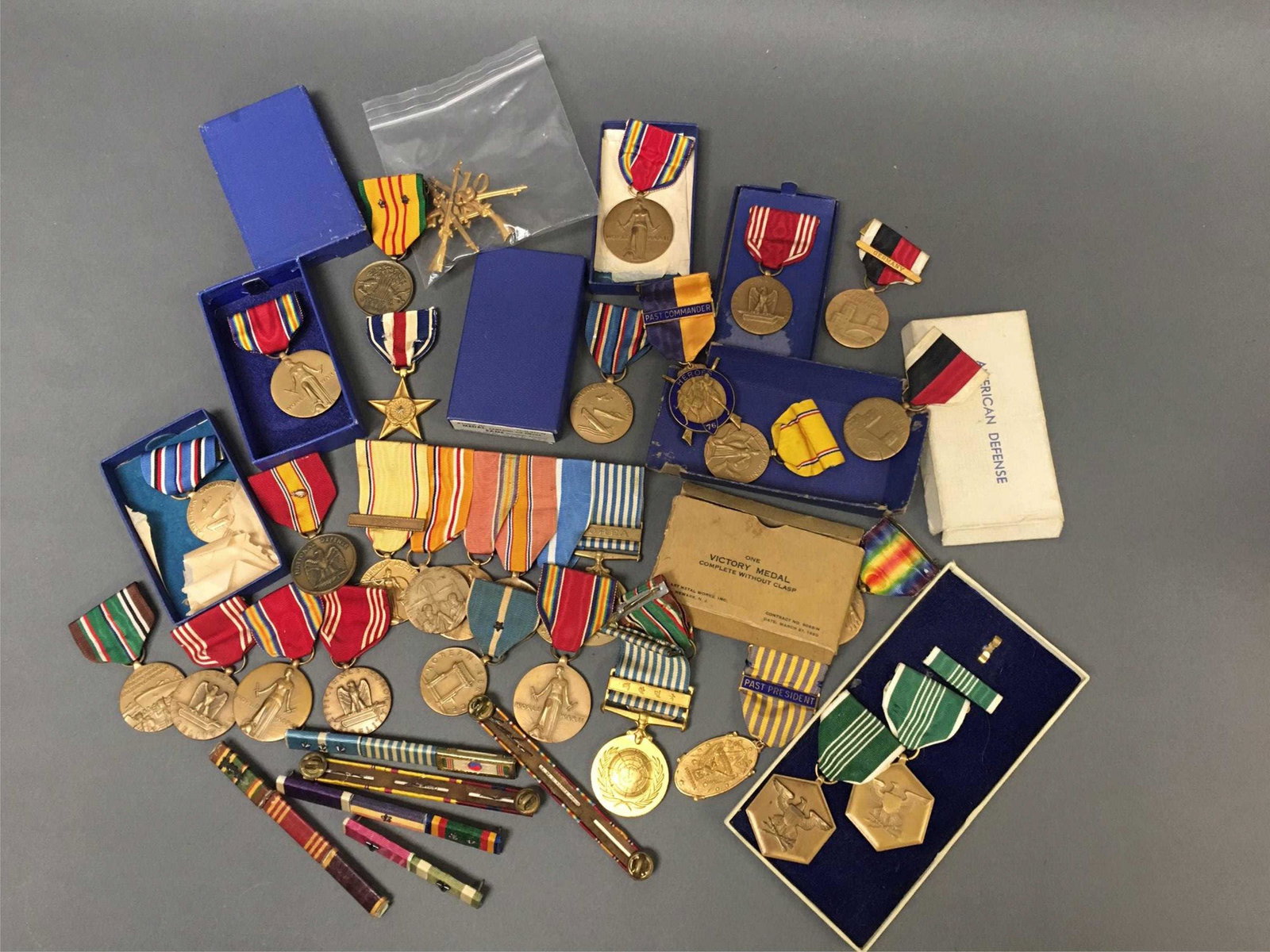 Collection Of Medals. Includes Victory, Service.: [Medals/Insignia] A collection of medals to include World War I Victory Medal (in box), WWII Victory Medal, United Nations Korean Service Medal, Vietnam Service Medal, Silver Star, 2 Bronze Stars (wit