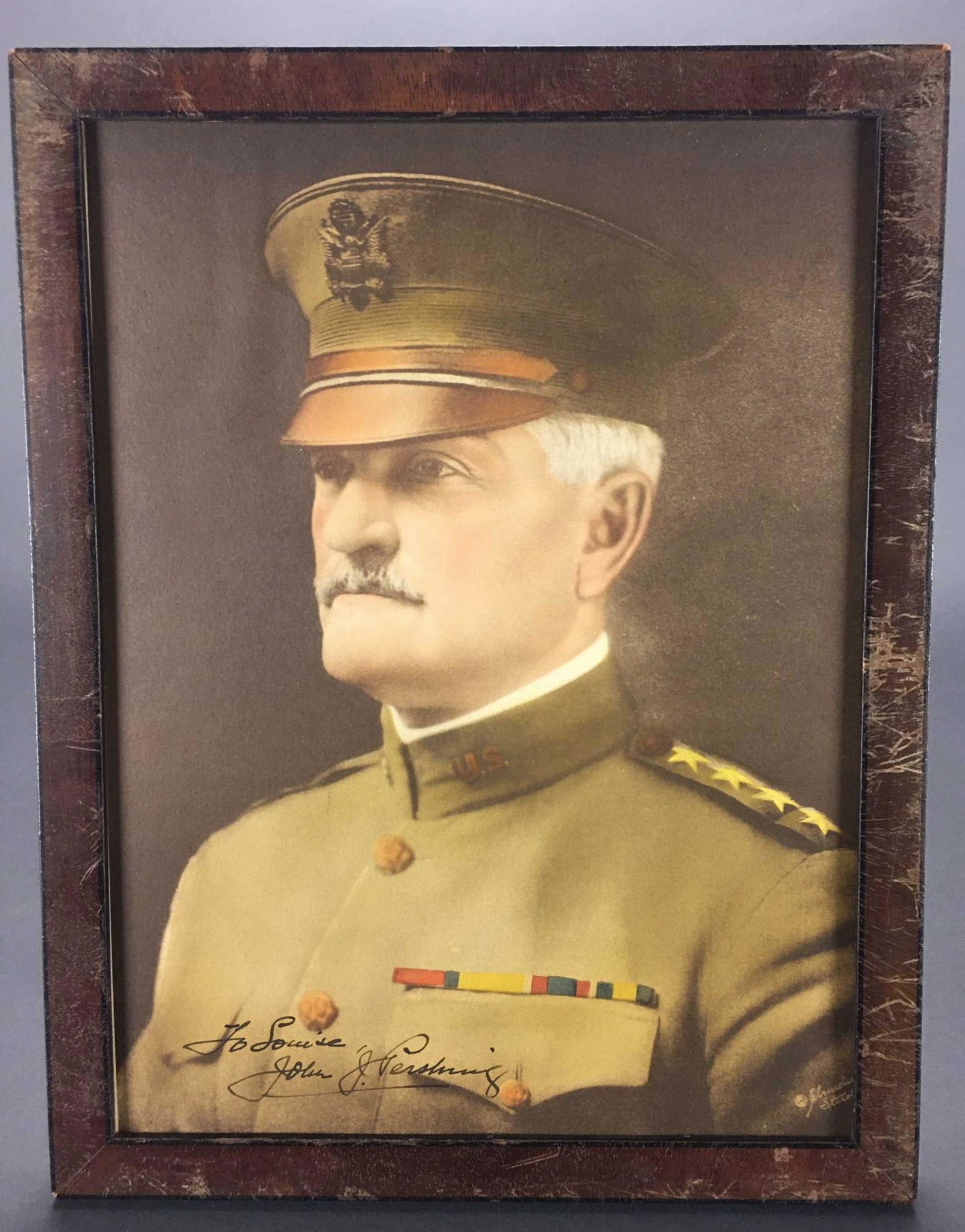 Signed Photo Of Gen John Pershing.: [Ephemera] Signed photo of General John "Black Jack" Pershing". Inscribed: To Louise, John J. Pershing". Colorized. In frame, no glass. 10 1/2" x 13 1/2". ++ Group of various medals & pins._x000D_ Con