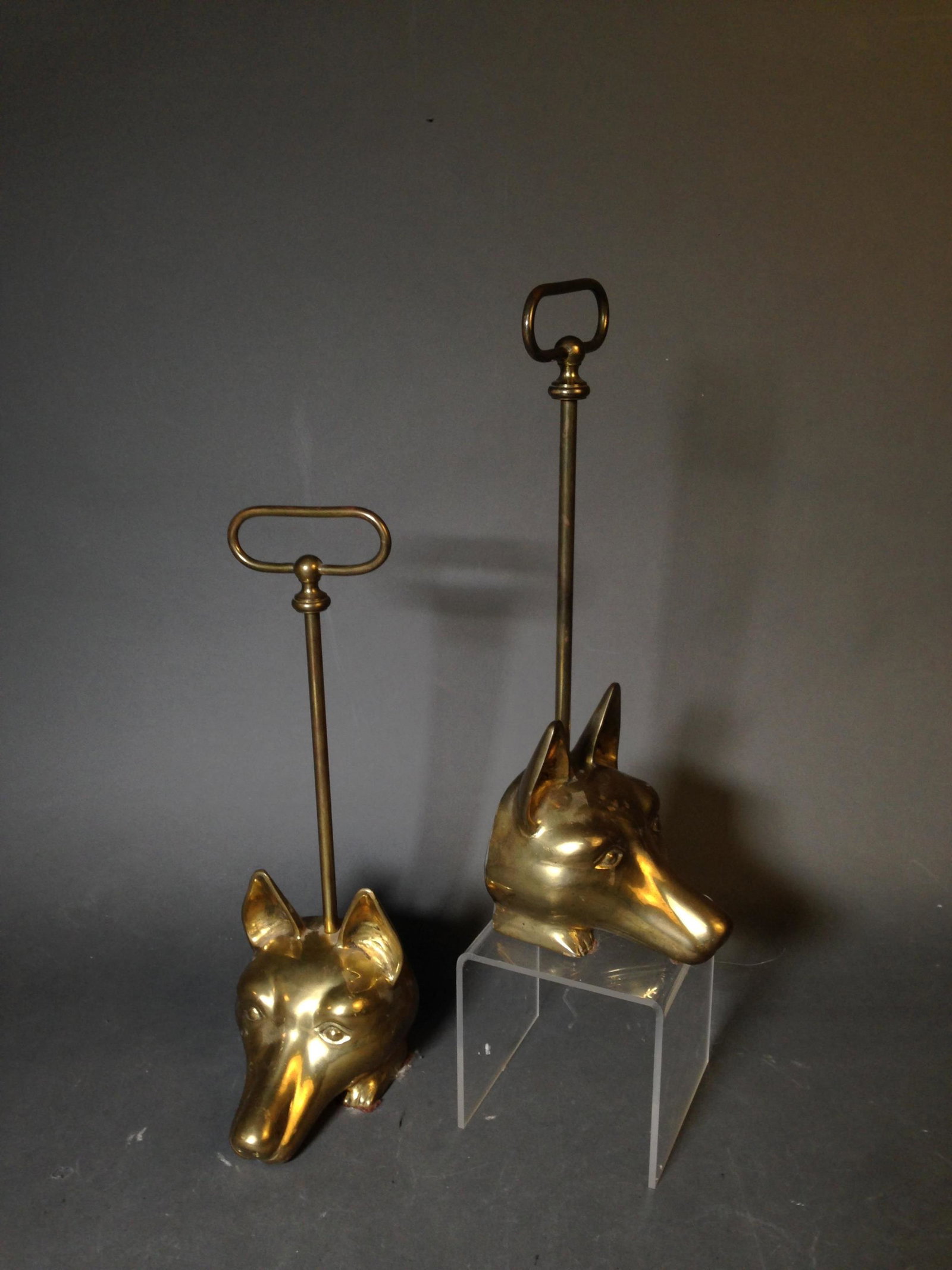 Pair of Maitland Smith Brass Wolf Head Door Stops: Pair of Maitland Smith Brass Wolf Head Door Stops with Carrying Handles ++ 15" tall_x000D_ Condition: No scuffs or damage.
