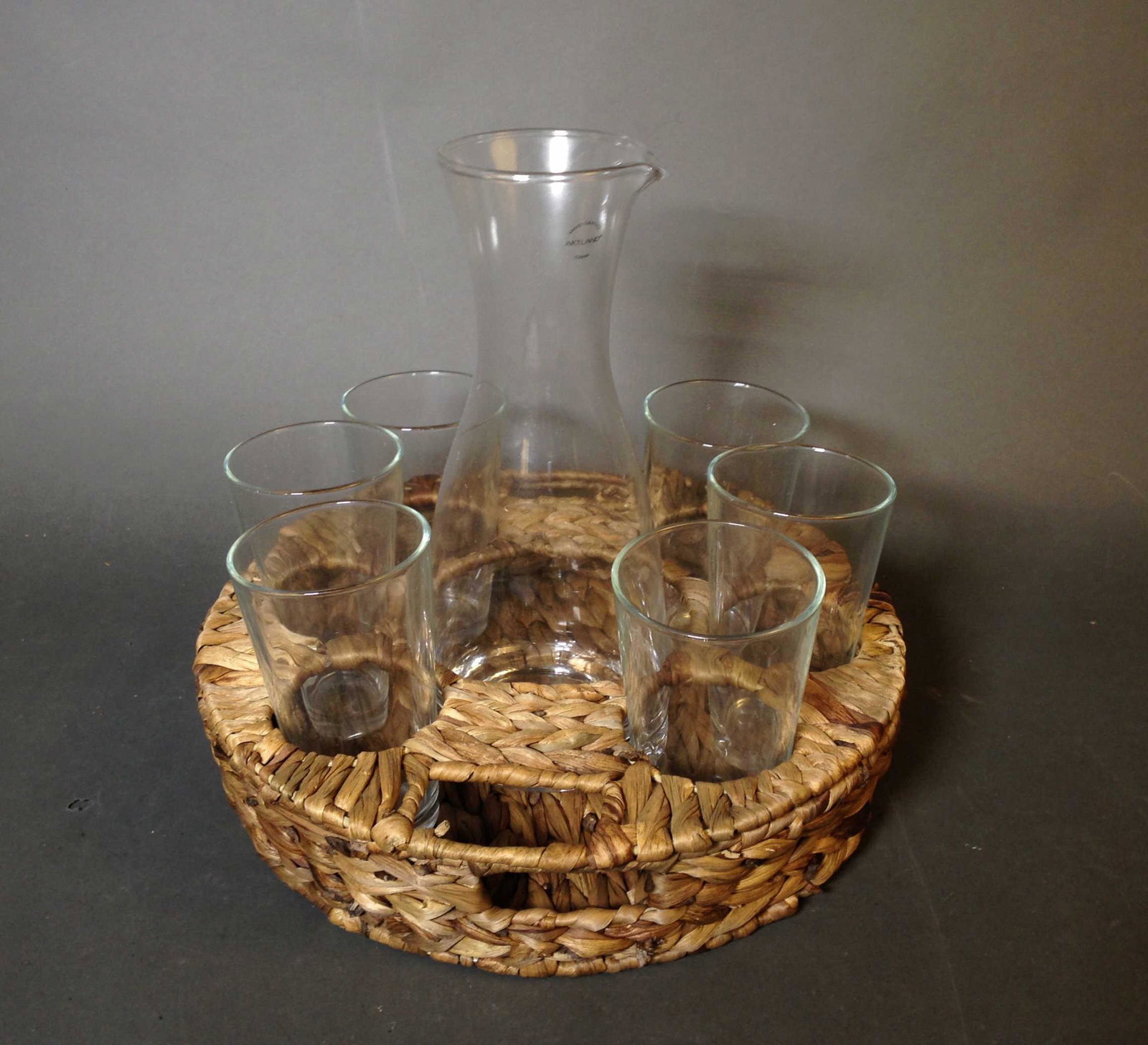 Artland Garden Terrace Wine and Beverage Set: Artland Garden Terrace Wine and Beverage Set ++ Including woven holder, pitcher and six glasses ++ Pitcher 11.75' tall and glasses 5.75"_x000D_ Condition: Like new condition.