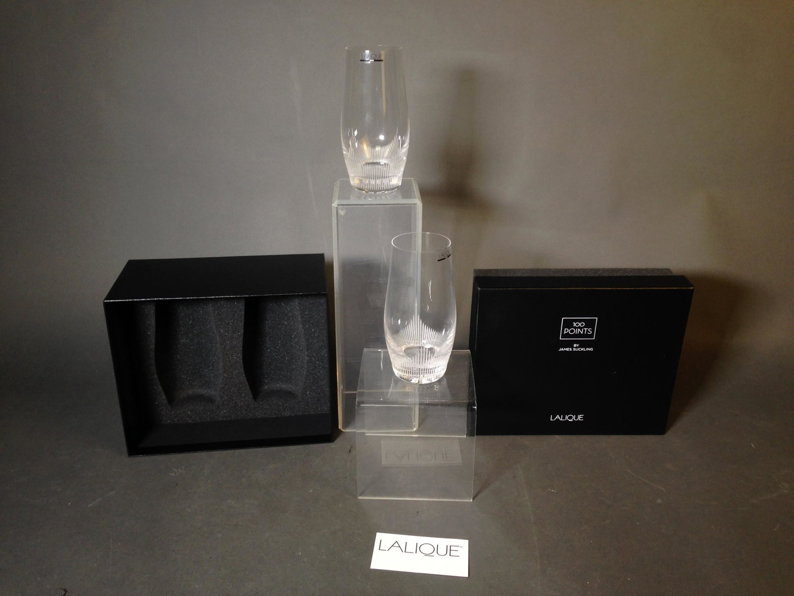 James Suckling Lalique Crystal Large Tumblers: A Pair of 100 Point Series by James Suckling Lalique Crystal Large Tumblers ++ Has presentation box ++ Glasses 6" tall and 10" x 8" x 5"_x000D_ Condition: Like new unused condition.