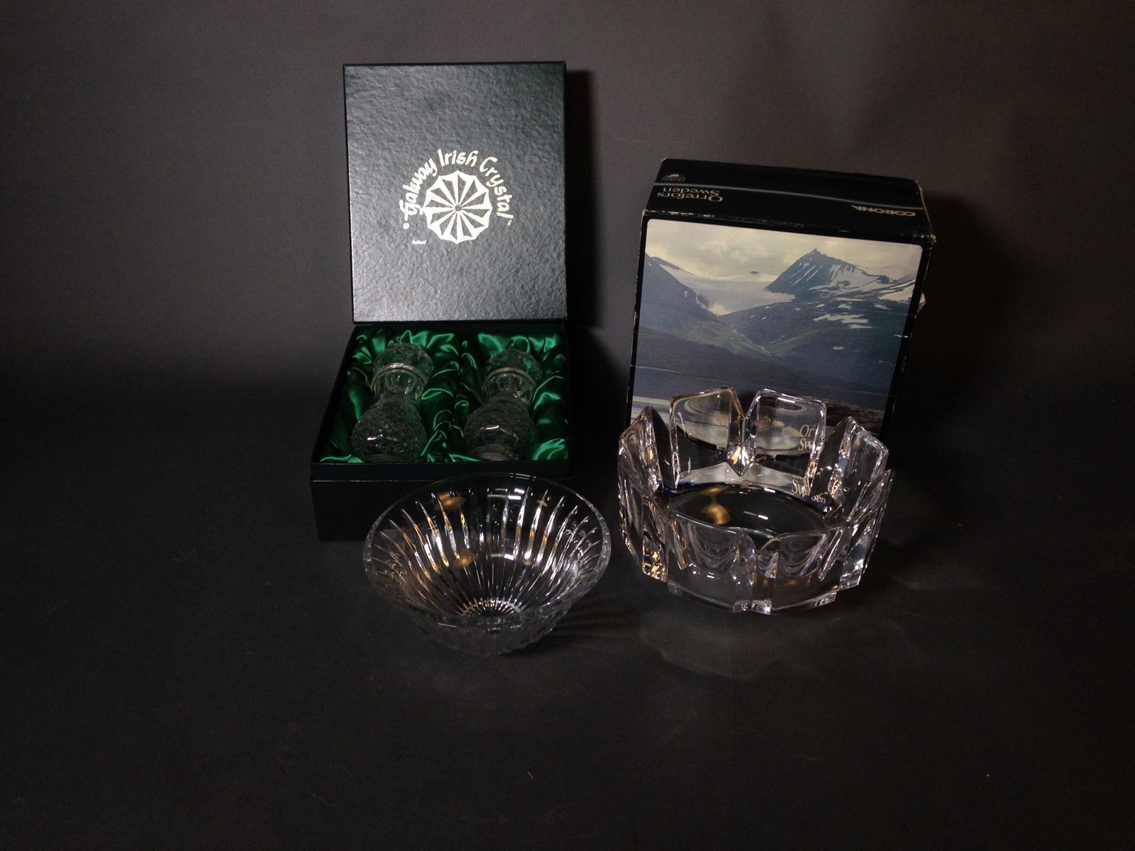 Three Crystal Pieces, inc. Orrefors & Galway: Three Crystal Pieces ++ 7" x 4" Orrefors crystal bowl with box, unmarked 3.5" x 7" crystal bowl, and Galway Irish Crystal 8" salt and pepper grinders in a box._x000D_ Condition: No visible chips or da