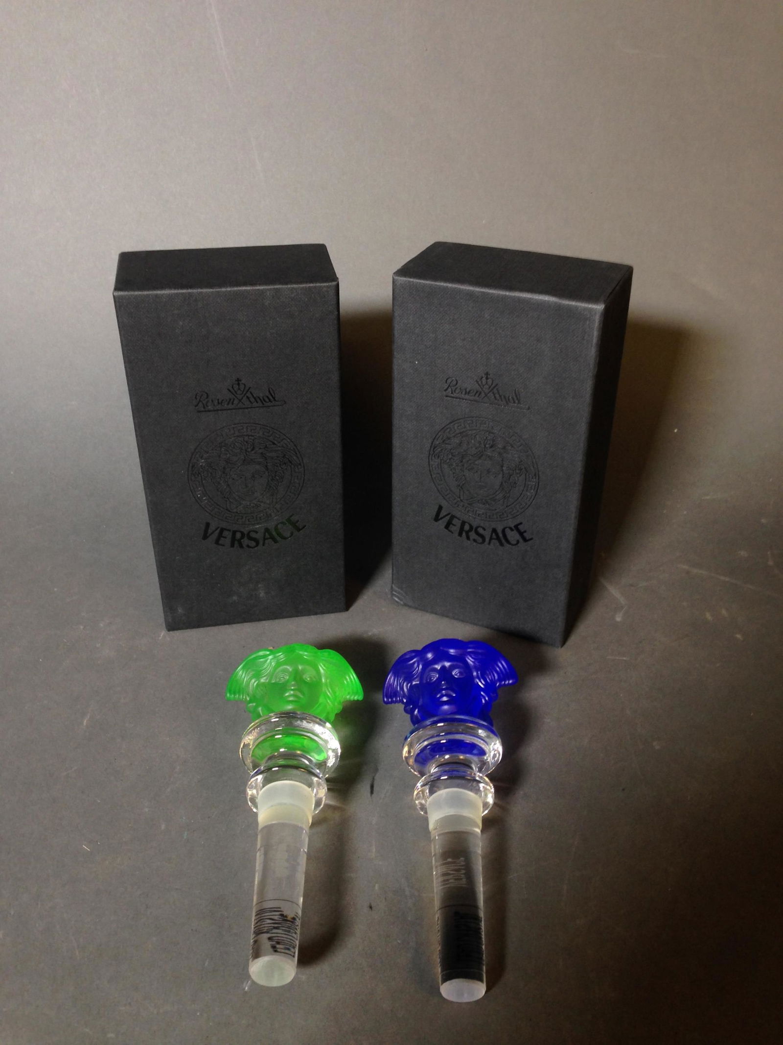Two Rosenthal for Versace Medusa Bottle Stoppers: Pair of Rosenthal for Versace Medusa Bottle Stoppers with Boxes ++ 5" long_x000D_ Condition: New condition.
