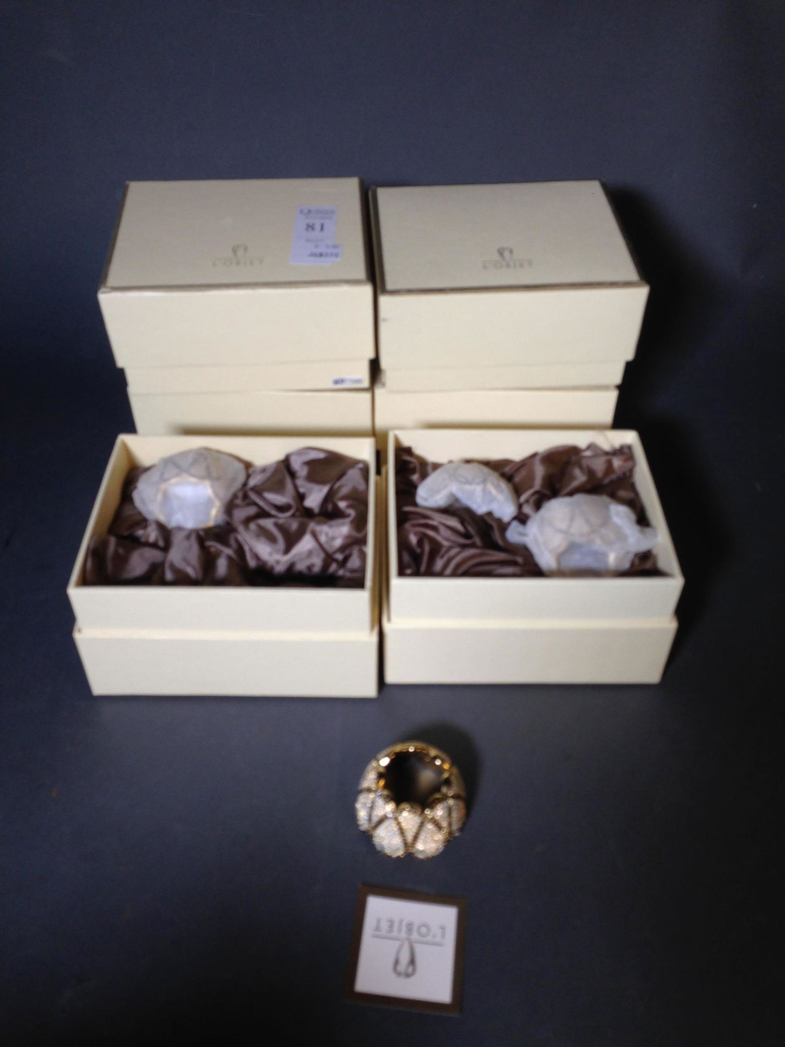 12 New L'Objet Designer Napkin Rings in Boxes: 12 New L'Objet Designer Napkin Rings in Boxes ++ 2" x 1.25"_x000D_ Condition: New condition, unopened.