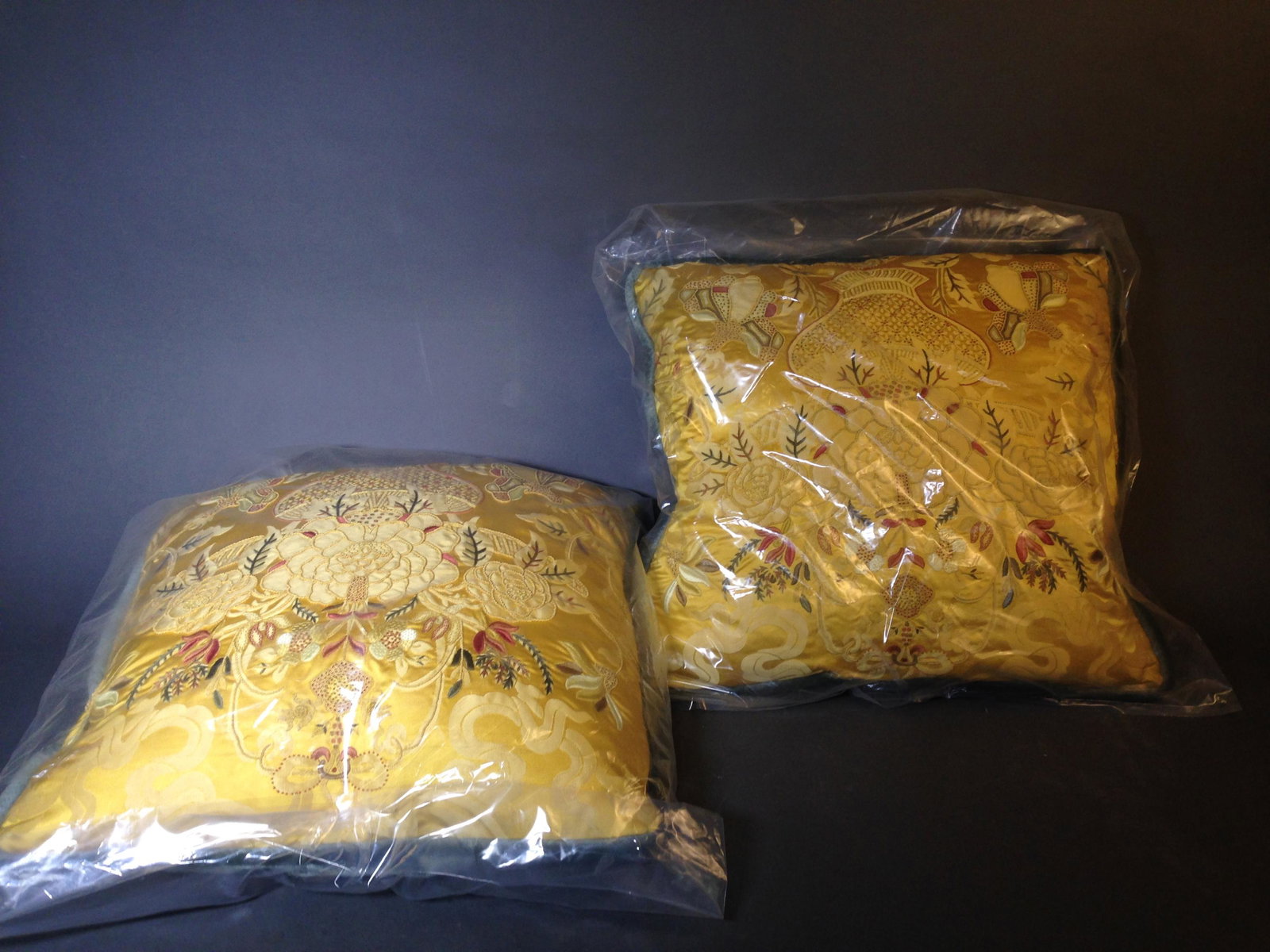 Two Designer Gold Throw Pillows: Two Designer Gold Throw Pillows with Chinese Style Vase with Flower Design ++ 20" x 20"_x000D_ Condition: New condition, with original bags.