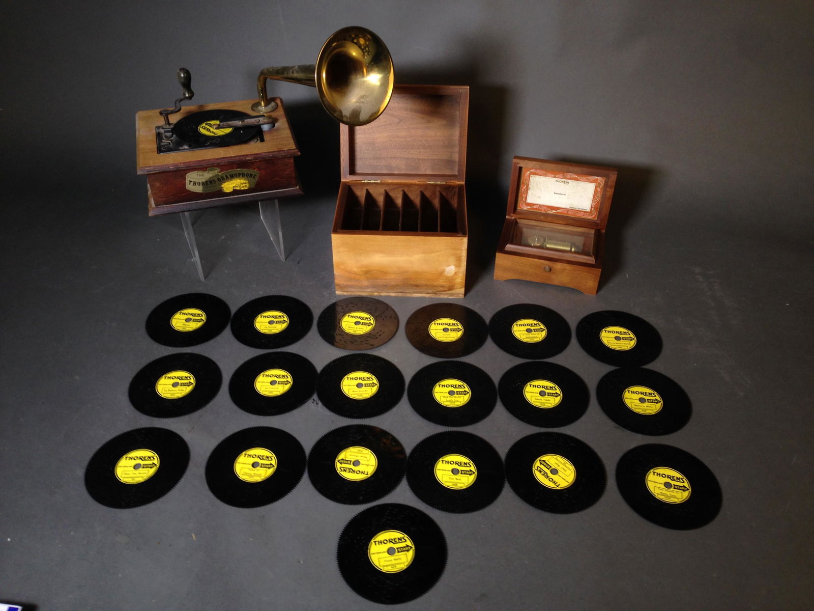 Thorens Gramophone & Music Box, w/ 17" Disks: Thorens Gramophone & Thorens Music Box, w/ 17" Pierced Thorens Disks ++ Thorens gramophone, 8" x 6" x 3" ++ Thorens music box playing Greensleeves, 5.75" x 3.75" x 2.5"_x000D_ Condition: Gramophone wo