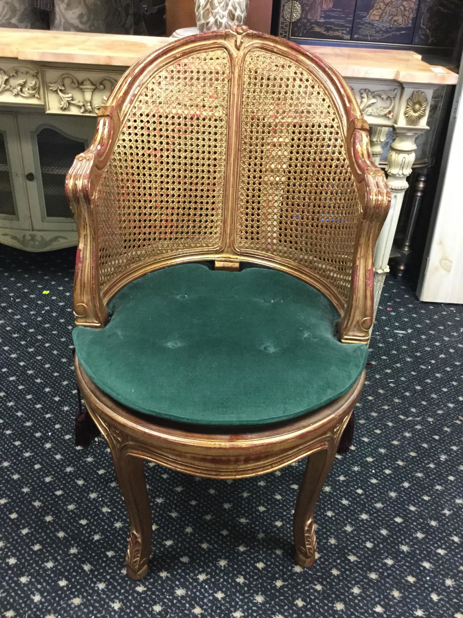 Caned barrel back chair: A caned barrel back chair. Two rounded cane splats. Upholstered cushion.