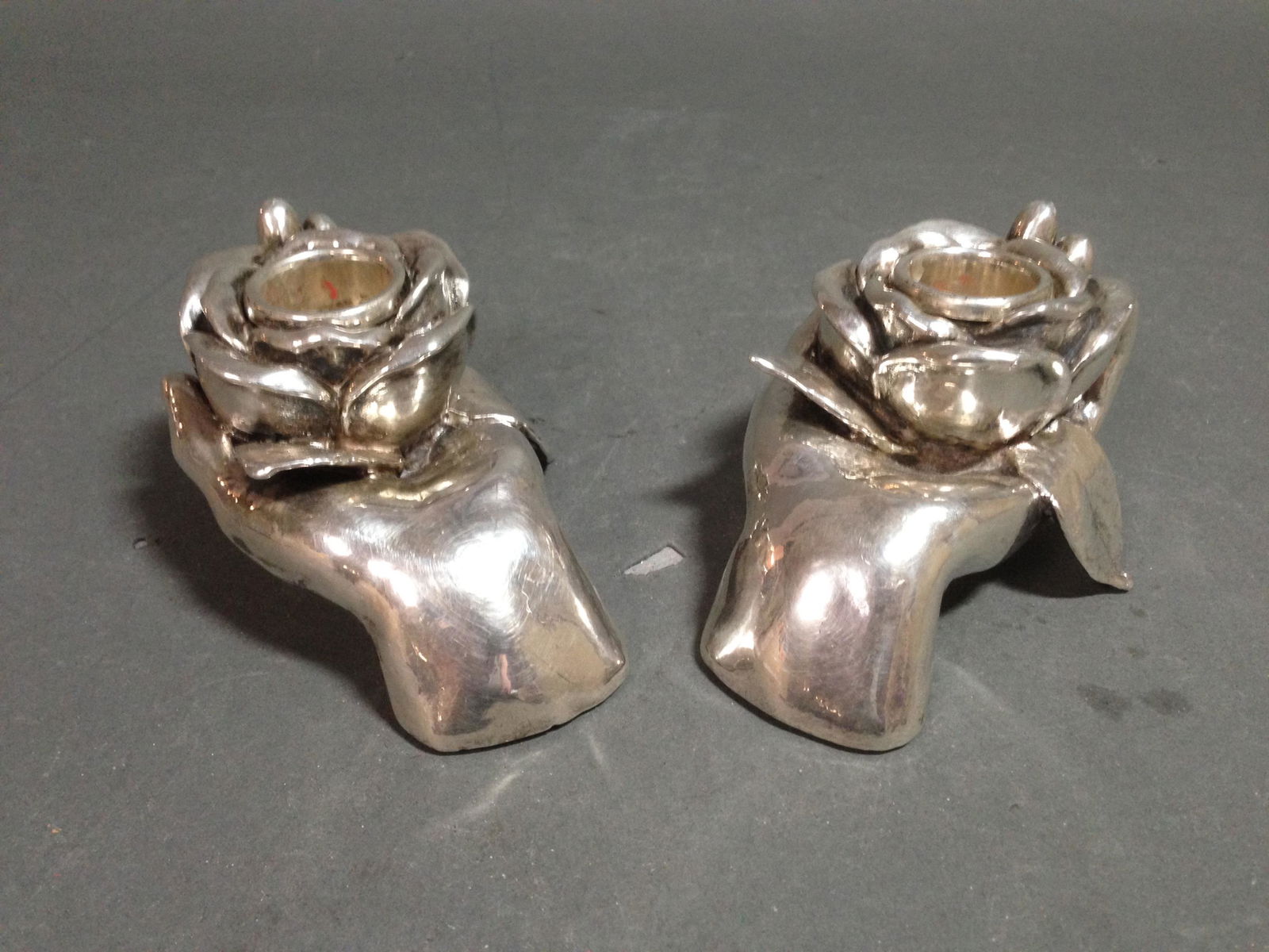 2 Israel SterlingHand Shaped Candle Holders: A group of two Sterling marked hand shaped candle holders from Israel