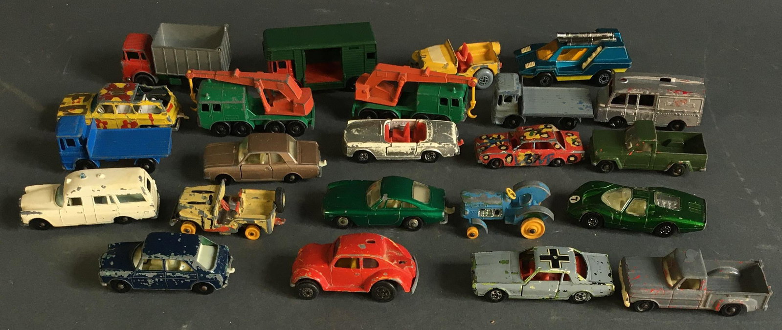 23 Lesney Diecast Matchbox Cars: 23 Matchbox cars and trucks made by Lesney, England. Mostly undated, a few 1969-1975 copyright dates on undersides. Length: Approx. 2 1/2" to 2 3/4".