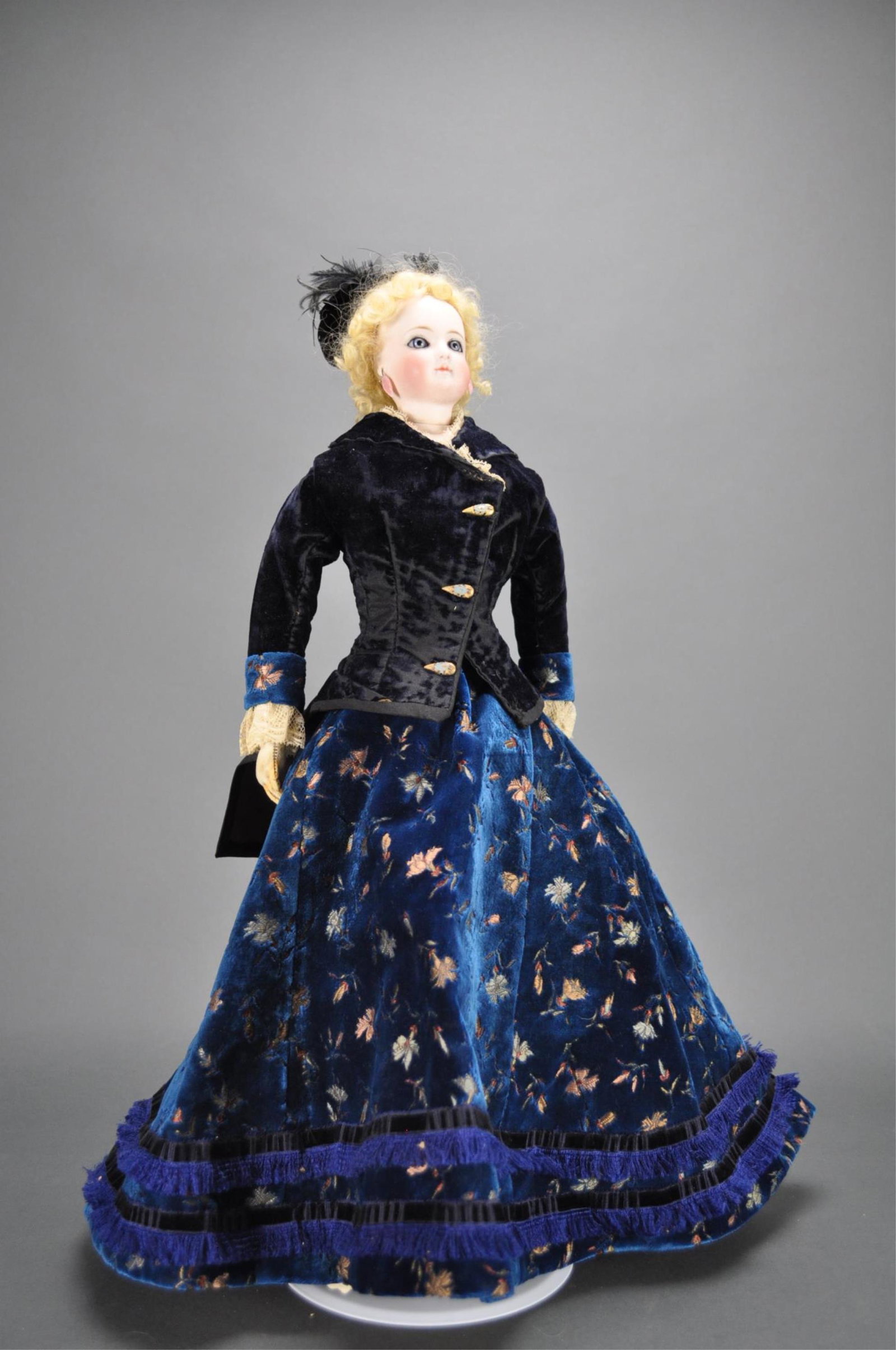 French Bisque Poupee. Jumeau. Body Stamped.: 20" (51 cm.) Bisque swivel head on kid-edged bisque shoulder plate, large blue glass enamel inset eyes,very thick dark eyeliner, painted lashes, feathered brows, accented nostrils, closed mouth with a