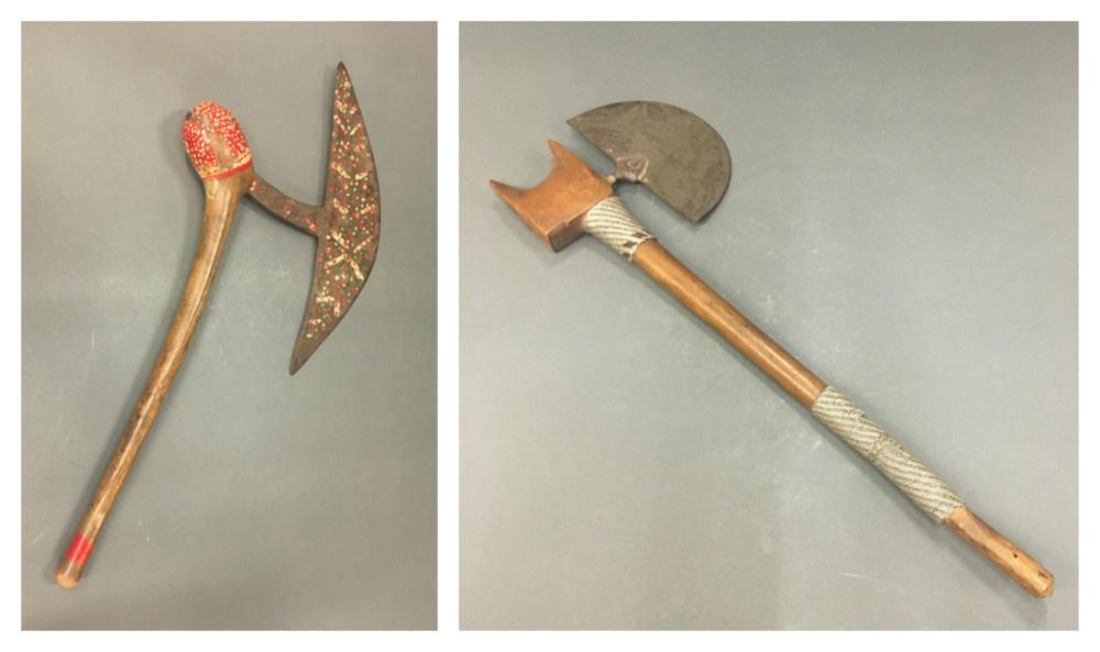 2 South African Axes. 20th c.: A group of two South African axes. Wood and metal. 20th century. ++ Shona axe. 22 1/2" x 10" x 2". Faded and worn paint. Wear and accretions throughout. ++ Zulu style axe. 20 1/4" x 7" x 1 1/4". Wear