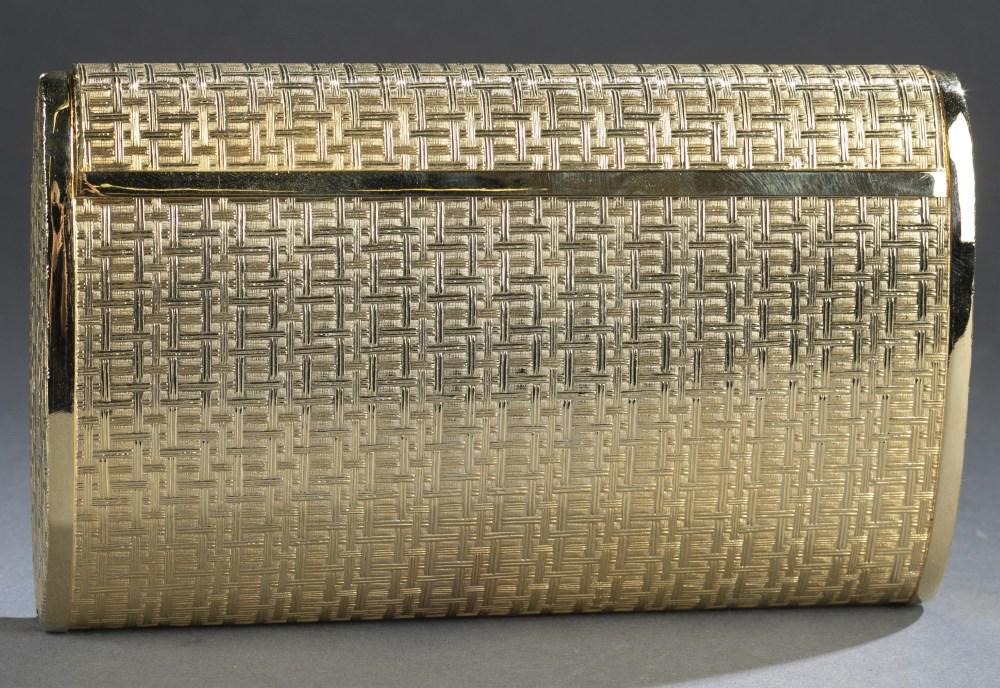 Magid, Gold tone handbag.: A Magid gold tone handbag. Gold tone metallic body with geometric pattern. Top flap closure. Interior black velvet lining. Marked on interior. Includes box and gold tone chain shoulder strap. 4 1/2" x