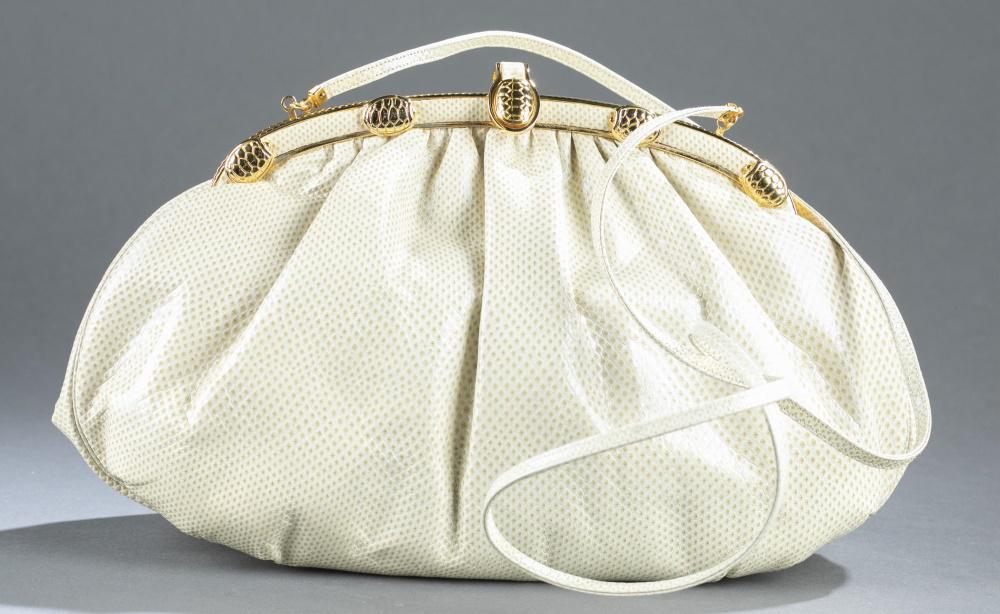 Judith Leiber, lizard leather turtle clutch.: A Judith Leiber lizard leather turtle clutch handbag. Beige lizard leather exterior. Gold tone frame with turtle shell detail on frame. Marked on interior. Silk lining. Includes shoulder strap, mirror