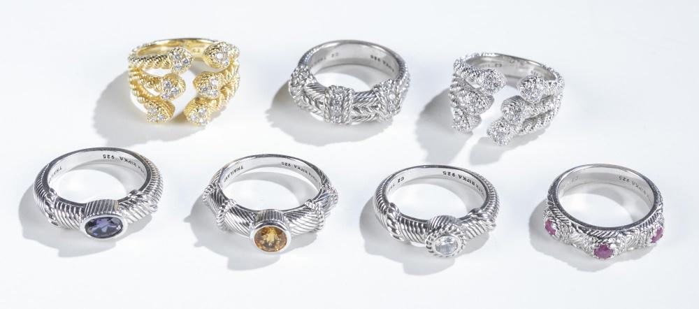 7 Judith Ripka, sterling silver rings.: A group of seven Judith Ripka sterling silver rings. Stamped inside band. ++ Multi-band ring, with pave hearts of cubic zirconia . Size 7. Approx, 8g. ++ Gold tone multi-band ring with pave hearts of
