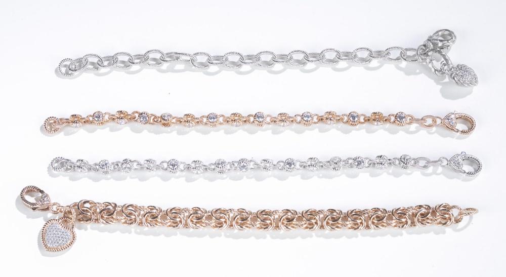 4 Judith Ripka, sterling silver bracelets.: A group of four Judith Ripka sterling silver bracelets with lobster claw clasps. Stamped on clasps. ++ Cable chain link bracelet with a pave cubic zirconia heart charm . 7". Approx, 16g. ++ Rose gold