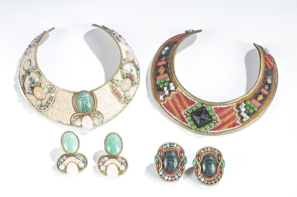 2 M & J Hansen, jewelry sets, 1988.: A group of two M & J Hansen jewelry sets. Marked on back. 1988. ++ White beaded and metal collar necklace and clip on earrings. Necklace: 6 1/2". Approx. 121 g. Earrings: 2". Approx. 30 g. ++ Multi-co