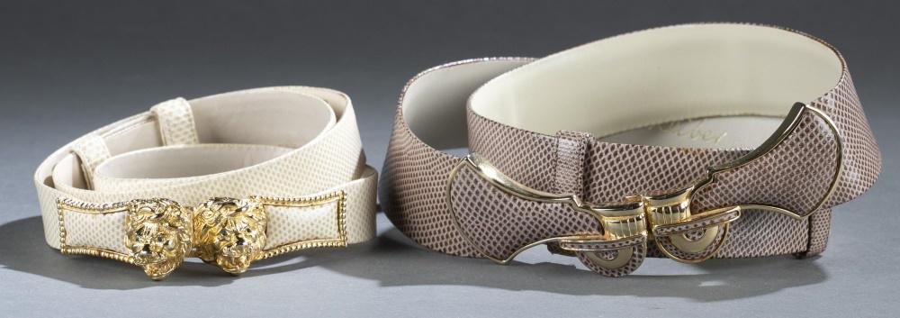 2 Judith Leiber, belts.: A group of two Judith Leiber belts. Gold tone hardware. Marked on interior. Includes dust covers and boxes. ++ Double lion head, beige belt. Overall 36". ++ Pink belt. Overall 36".