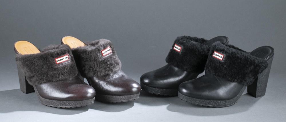 2 Pairs of Hunter platform mules.: Two pairs of Hunter fur trimmed leather platform mules with block heels. One brown, one black. Size 9. Comes with dust bags.