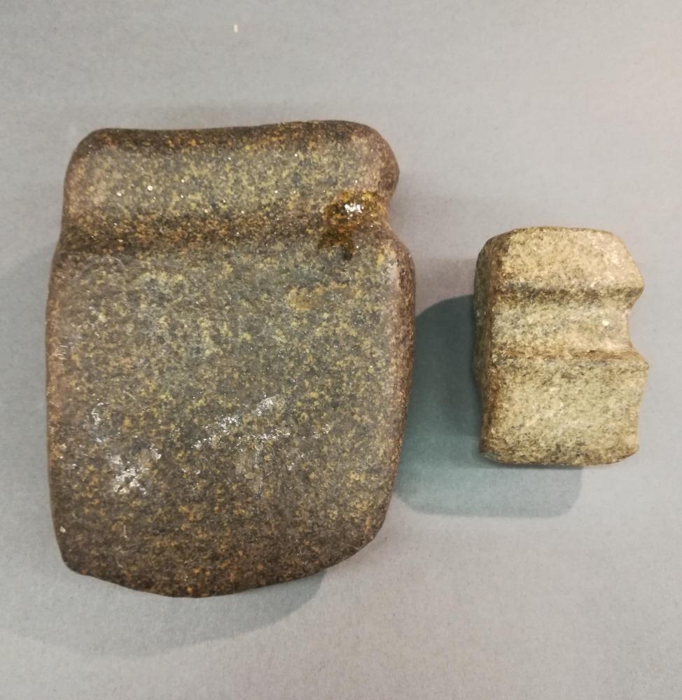 2 Pre-Columbian Stone Axe Heads.: A group of two Pre-Columbian stone axe heads. Mesoamerica. ++ Larger 6" x 4 1/2" x 2". ++ Smaller 3" x 2" x 1 1/2".