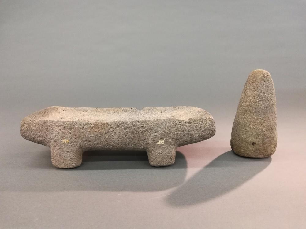 Central American Stone Metate & Pestle.: A Central American stone metate and pestle. ++ Matate. 3 3/4" x 14 1/2" x 6".++ Pestle. 7" x 3 1/4".