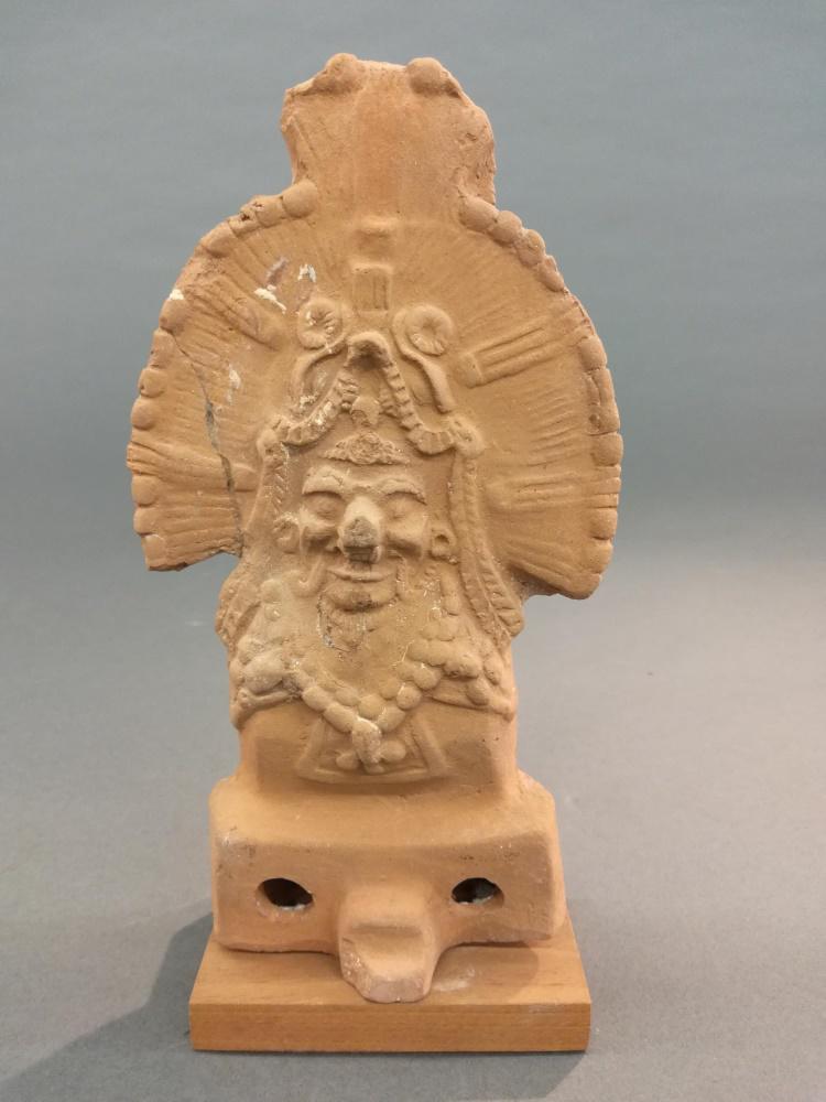 Maya Style Terracotta Figure. 20th c.: A Maya style terracotta figure. Mesoamerica. 20th century. 9" x 4 3/4" x 2 1/2". Has a repair to the perfect right and some abrasions._x000D_ Provenance: From the ex collection of Maudie Bullington of
