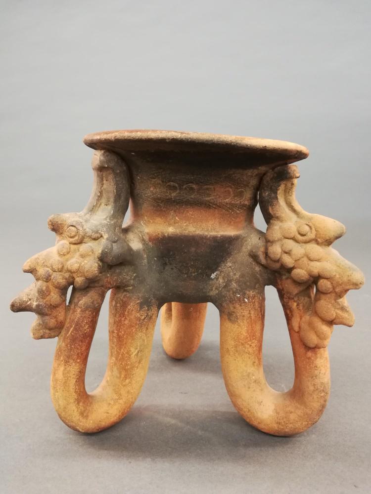 Chorotega Terracotta Tripod Vessel. 700-1000 CE.: A Chorotega terracotta tripod vessel. Las Mercedes, Limen, Costa Rica. 700-1000 CE. 7 3/4" x 8"._x000D_ Condition: Some chipping and cracks.