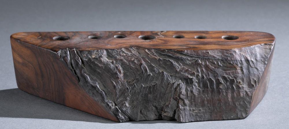 Mira Nakashima, pen holder, 1999.: A Mira Nakashima-Yarnell (American, b. 1942) pen holder. 1999. New Hope, Pennsylvania. Seven pen holes for storage. Signed and dated on bottom. 2" x 8" x 4"._x000D_ Condition: Slight wear to wood on t
