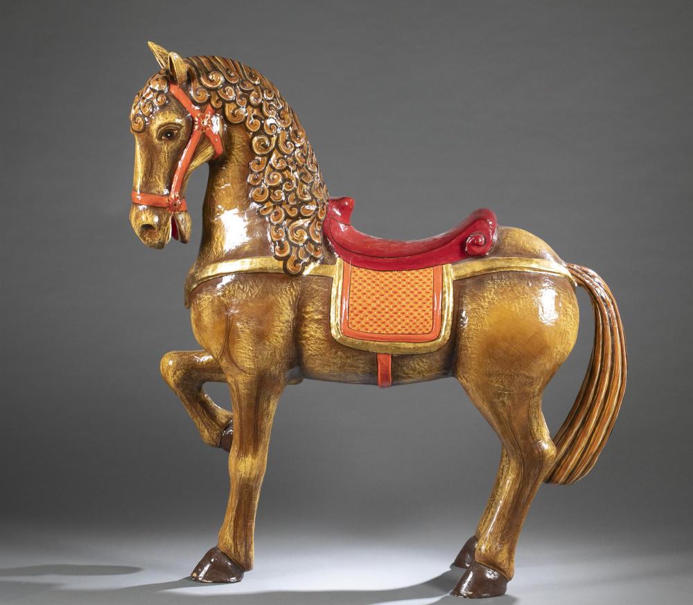 Sergio Bustamante, Papier Mache Carousel Horse.: Bustamante, Sergio (Mexican, b.1949). Large papier mache carousel horse having red saddle and bridle with gold highlights. Standing with right front hoof raised. Comes with custom wooden packing crate