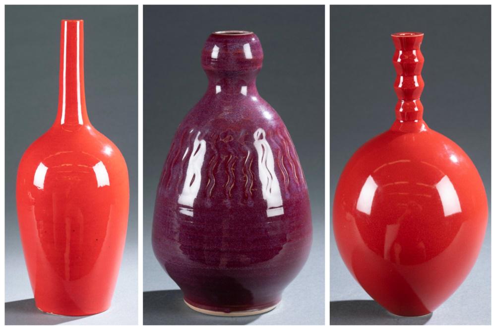 3 North Carolina ceramic vases.: A group of three glazed ceramic vases. Seagrove, North Carolina. 20th/21st century. Marked on bottom. ++Ben Owen III (b. 1968) red-violet vase. 2004. Tapered oval form. 9 1/4" x 5 1/2". ++Two Dover Po