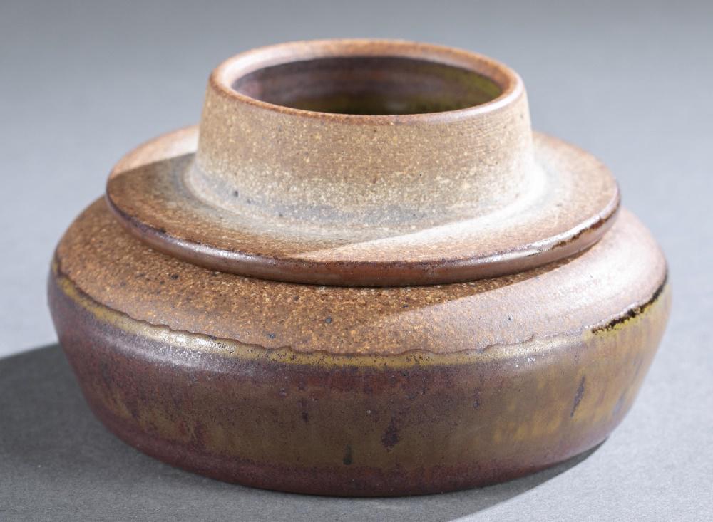 Val Cushing ceramic dish, 20th c.: Cushing, Val (American 1931-2013) glazed ceramic dish with lid. Swirl design on bottom of lid. Signed inside dish. 2 1/2" x 5". Shipping: This lot does not qualify for in house shipping. We will provi