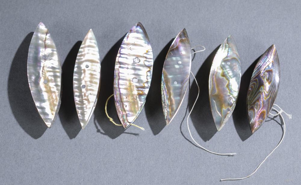 6 Abalone tatting shuttles.: A group of six abalone tatting shuttles. ++ 2 1/2". ++ 2 1/2". ++ 2 3/8". ++ 2 3/4". ++ 2 3/4". ++ 2 1/2".