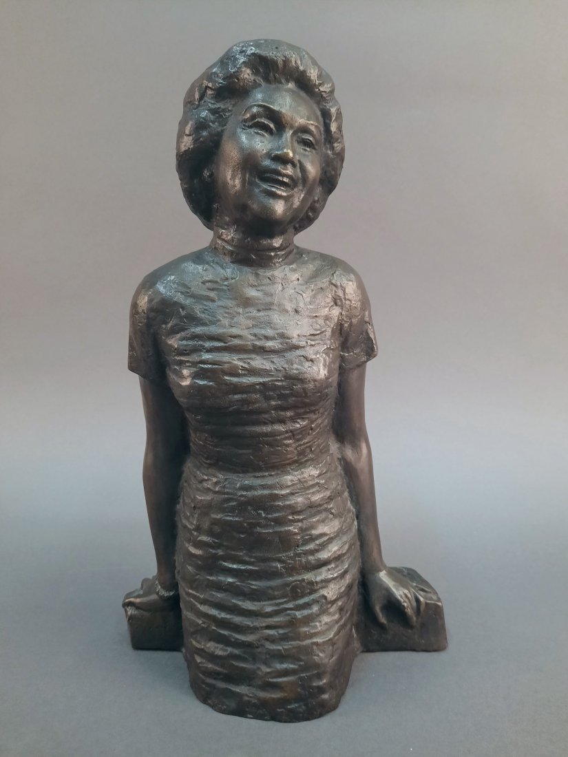Bronze sculpture of Anna Chennault, 1995.: A bronze sculpture of Anna Chennault. Three-quarter length bronze depicting Chennault smiling. Signed and dated on back. 14" x 8 1/2" x 4 1/4".