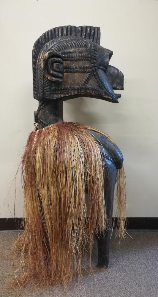 Baga Nimba Style Headdress. 20th c.: A Baga Nimba style headdress. 20th century. Wood and raffia. West Africa. 50" x 18" x 19".