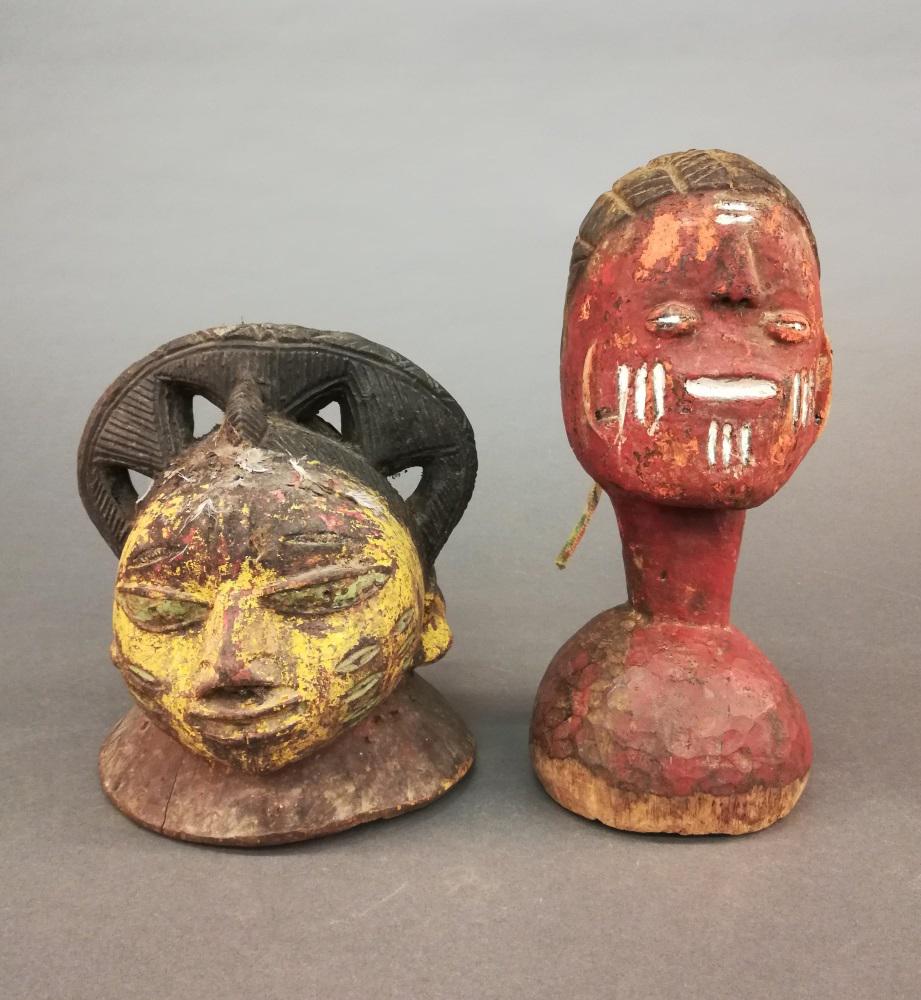 2 Nigerian Yoruba Head Crests. 20th c.: A group of two Nigerian Yoruba head crests. 20th century. Wood. West Africa. ++ 8 3/4" x 7 1/4" x 7 3/4". ++ 11 3/4" x 5".