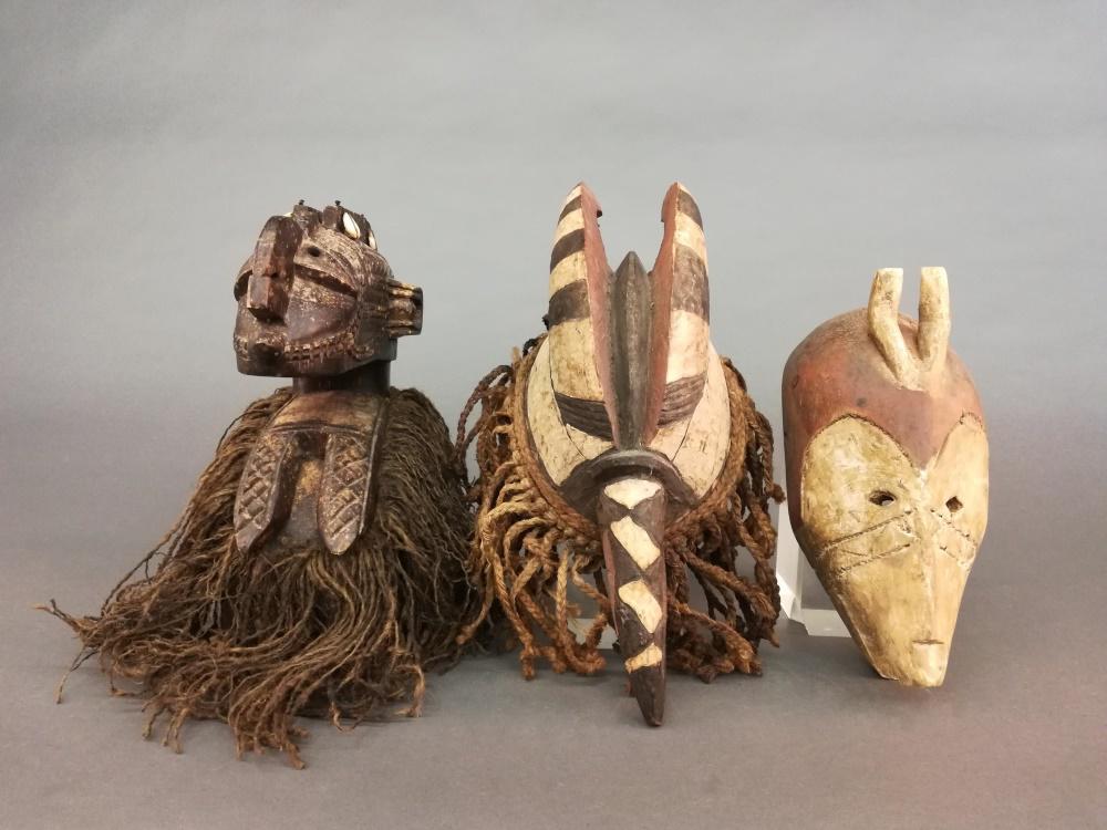 3 African Style Masks/Headdresses. 20th c.: A group of three African style masks/headdresses. 20th century. Wood. Largest 13 3/4" x 7 1/2" x 11". Smallest 11 1/2" x 5 1/2" x 4 3/4".