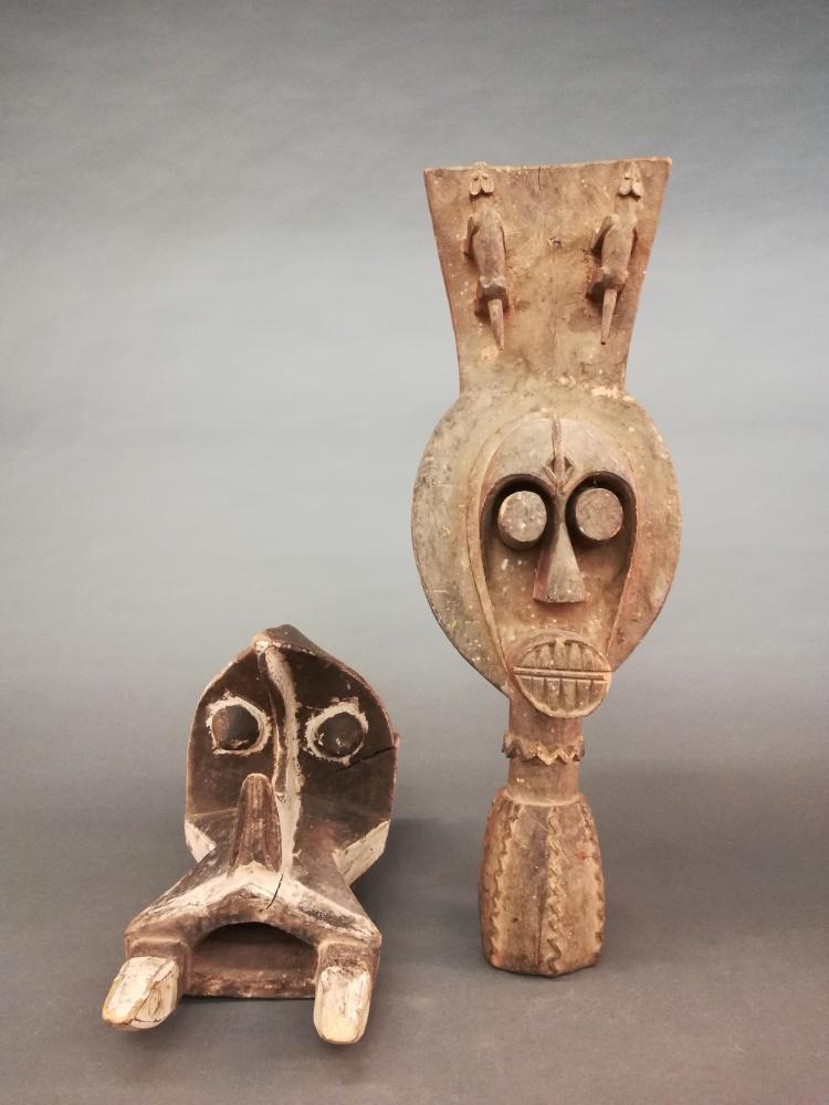 2 Nigerian Style Headdresses. 20th c.: A group of two Nigerian style headdresses. 20th century. Wood. ++ Igbo Izzi style headdress 12 1/2" x 8 3/4" x 18". ++ Ijo water spirit style headdress. 8 1/2" x 10" x 30".
