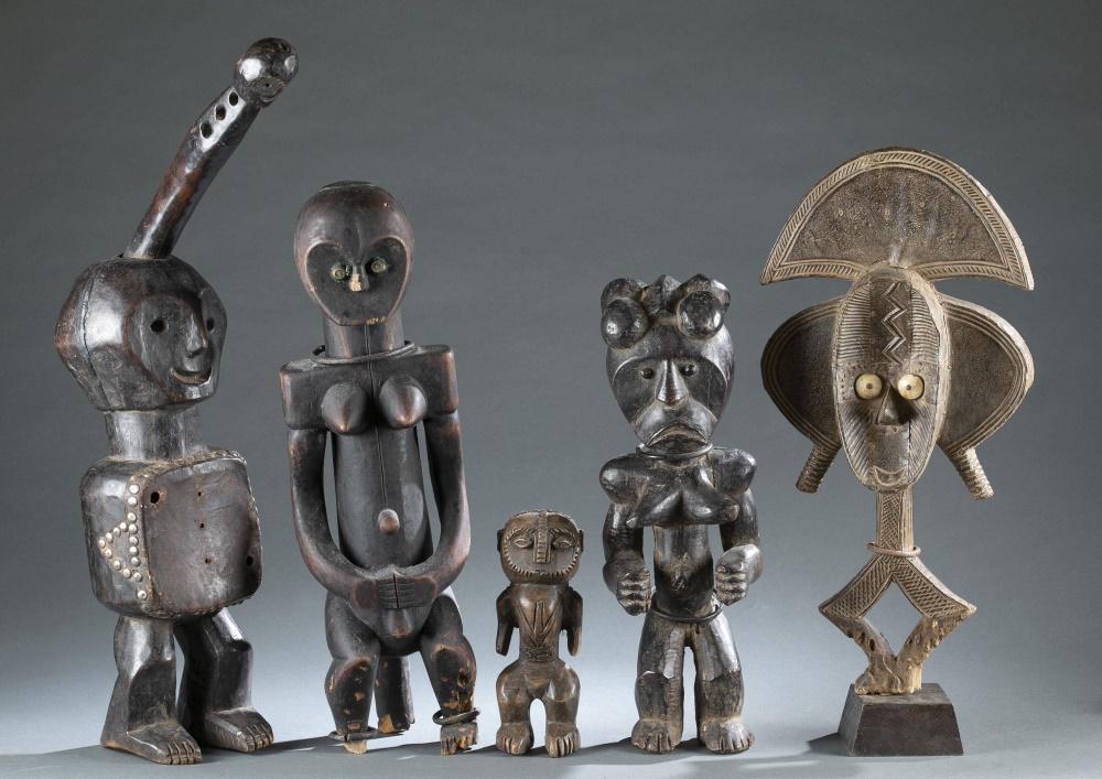 5 Central African Style Figures. 20th c.: A group of five Central African style figures. Wood, metal. 20th century. ++ 2 Gabon style figures. 27 3/4" x 6 1/4" x 14". ++ 2 Fang style figures. ++ Figure. 9" x 3 1/4" x 3 1/4". Items may not stan