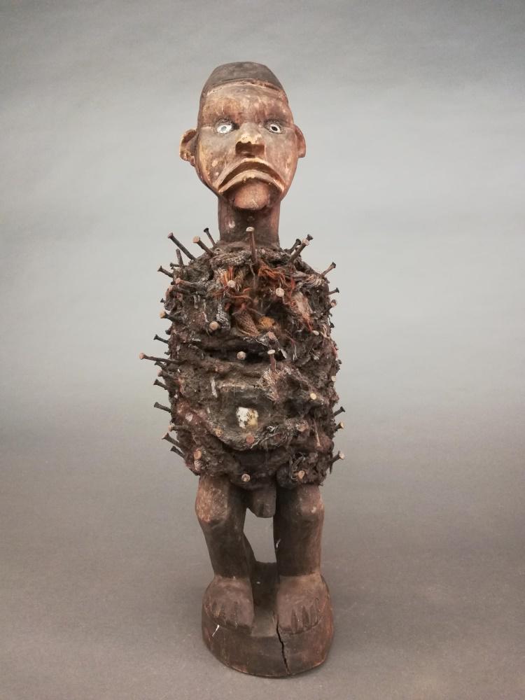 D. R. Cogo Style Power Figure. 20th c.: A D. R. Congo style power figure. 20th century. Wood, metal, glass, plastic, other natural materials. Central Africa. 25 1/2" x 8 1/2" x 7 1/2".