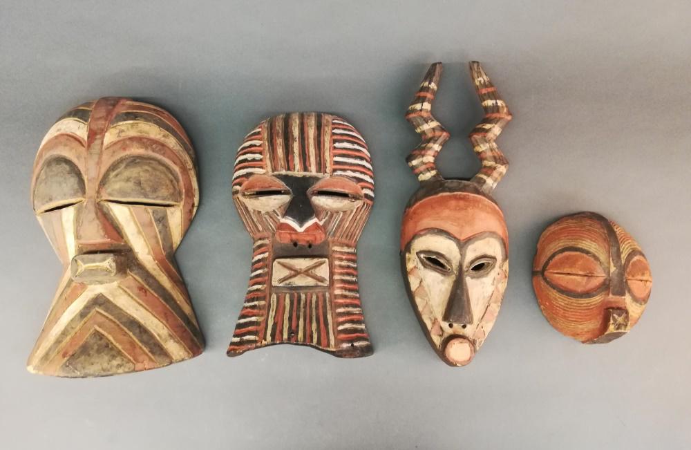 4 Central African Style Masks. 20th c.: A group of four Central African style masks. 20th century. Wood. Largest 15 1/4" x 9 1/4" x 4 1/2". Smallest 7 1/4" x 6 1/2" x 3 1/4".