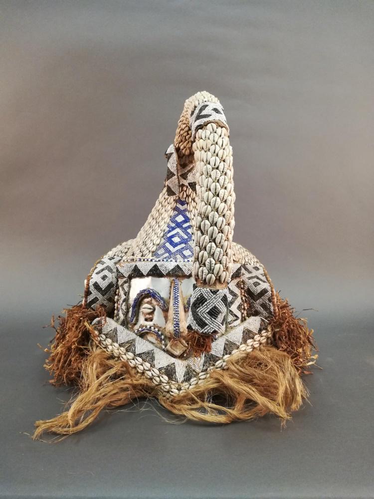 Kuba Style Helmet Mask. 20th c.: A Kuba style "Mwash A Mbooy" helmet mask. 20th century. Central Africa. Approx. 19 1/2" x 18" x 20.