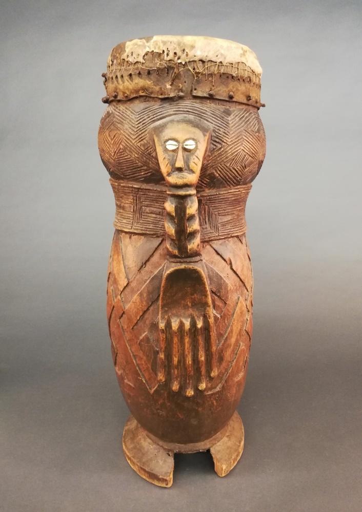 Kuba Style Drum. 20th c.: A Kuba style drum. 20th century. 29 1/2" x 11 1/2" x 10". Cracks and chipping throughout. Tear to leather.