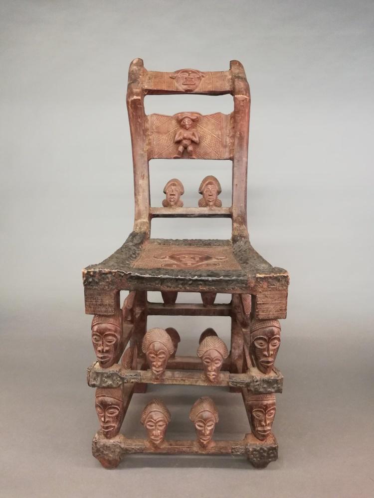 Chokwe Style Chair. 20th c.: A Chokwe style chair. 20th century. Wood and metal. Central Africa. 42 1/2" x 17 1/2" x 27 1/2".
