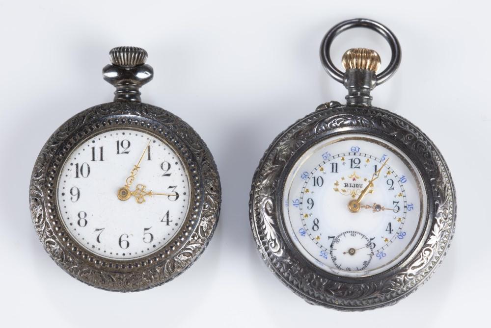 2 Ladies silver pocket watches.: A group of two ladies silver pocket watches. ++ Ladies Bijou .900 silver pocket watch. Swiss made movement. Watch currently running. Face diameter: 25mm. Case diameter: 35mm. ++ New England Watch Comp