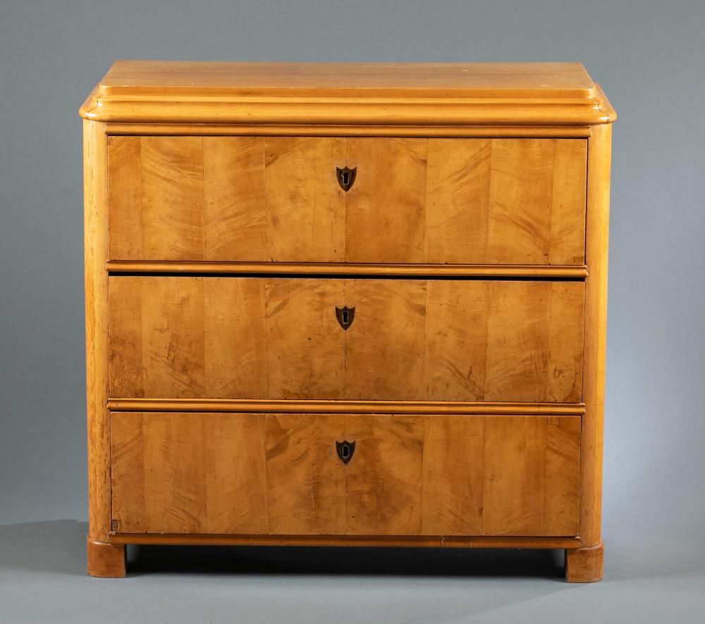 Maple chest of drawers, E. A. Nasman & Co, 20th c.: A maple chest of drawers. 20th century. Austrian. Rectangular top with three drawers with shield form key holes. Marked "E. A. Nasman & Co." on top drawer lock. 34 3/4" x 36 1/2" x 15". Shipping: This