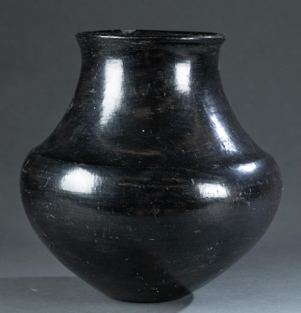 Santa Clara Pueblo Blackware Pottery Jar, c. 1920.: A Santa Clara Pueblo blackware pottery jar/vessel. Circa 1920. 10 1/8" x 9". Includes a certificate of authenticity from Mark Sublette Medicine Man Gallery Inc. Condition: scratches, small dents, and